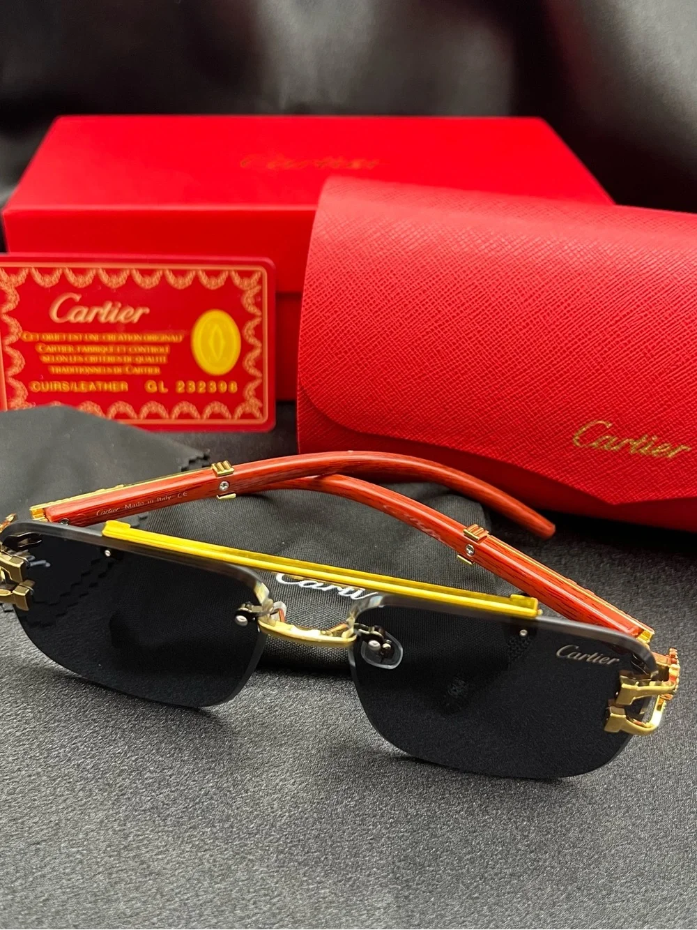 Cartier Men’s Black and Gold Rimless Sunglasses